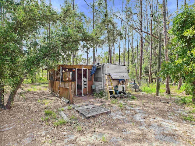 18722 Key Deer Ct, Keaton Beach, FL 32348 - back of house with exterior structure and an outdoor structure