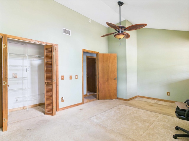 18722 Key Deer Ct, Keaton Beach, FL 32348 - unfurnished bedroom featuring high vaulted ceiling, carpet flooring, baseboards, a closet, and a ceiling fan