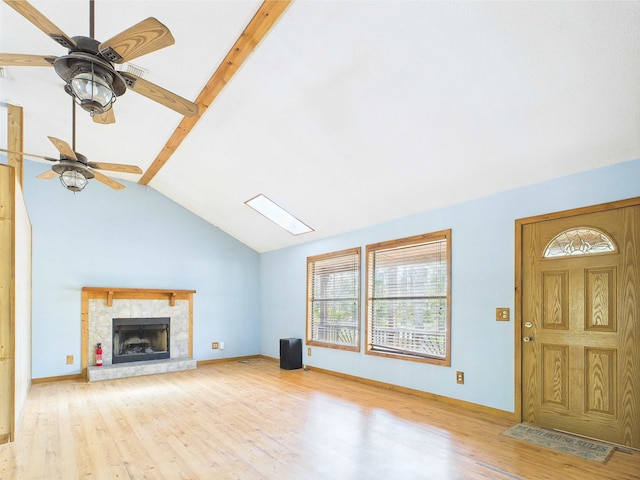 18722 Key Deer Ct, Keaton Beach, FL 32348 - unfurnished living room with wood finished floors, ceiling fan, a fireplace, and baseboards