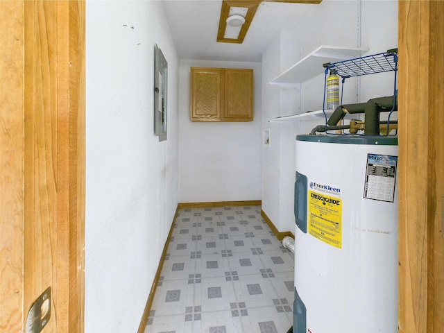 18722 Key Deer Ct, Keaton Beach, FL 32348 - washroom featuring water heater, light floors, electric panel, and baseboards