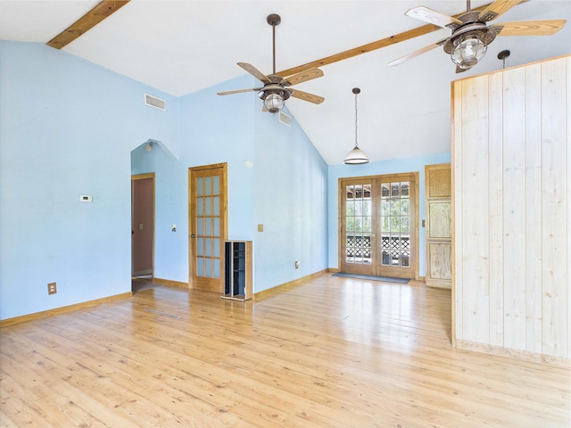 18722 Key Deer Ct, Keaton Beach, FL 32348 - unfurnished living room with a ceiling fan, french doors, beamed ceiling, wood finished floors, and high vaulted ceiling