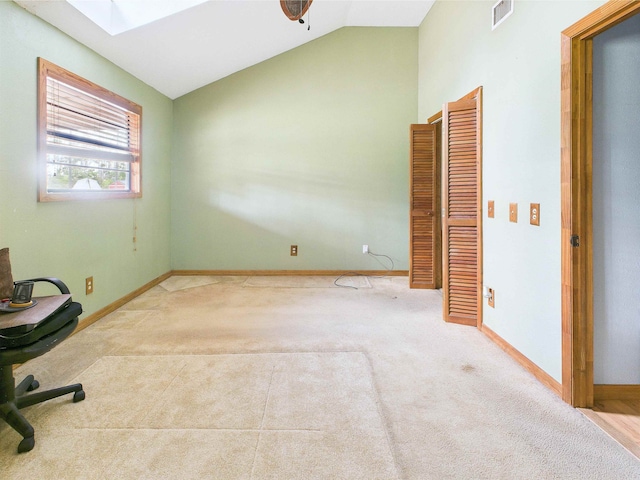 18722 Key Deer Ct, Keaton Beach, FL 32348 - unfurnished office featuring vaulted ceiling, carpet flooring, a skylight, and baseboards