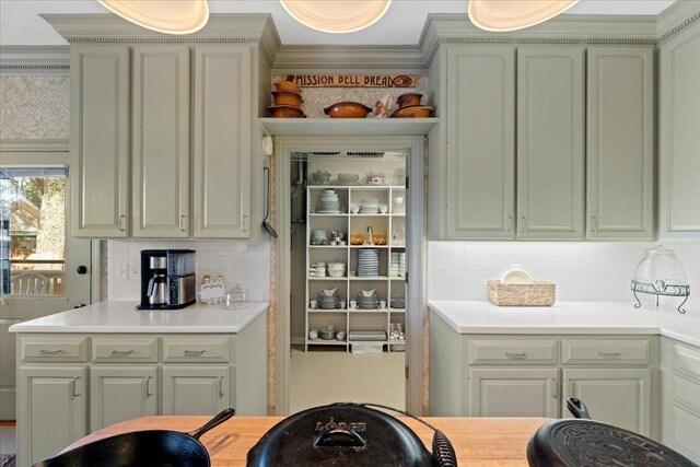 231 Sheline Dr, Havana, FL 32333 - kitchen featuring light countertops, backsplash, and ornamental molding