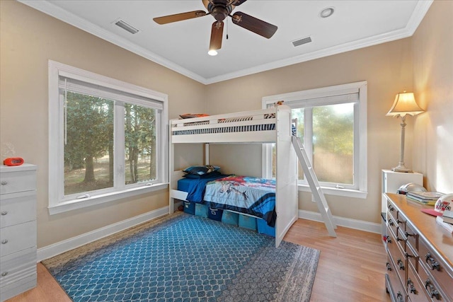 231 Sheline Dr, Havana, FL 32333 - bedroom with multiple windows, light wood-style floors, ornamental molding, baseboards, and a ceiling fan