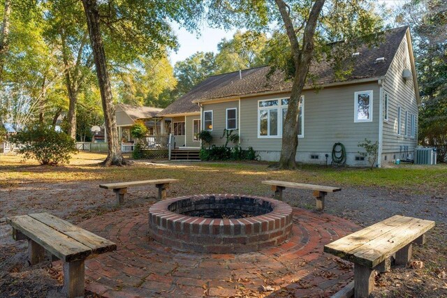 231 Sheline Dr, Havana, FL 32333 - back of property featuring a fire pit, crawl space, a deck, and central AC unit
