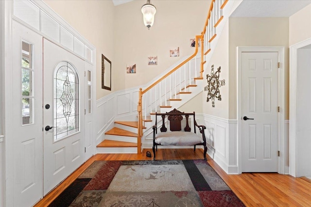231 Sheline Dr, Havana, FL 32333 - entrance foyer featuring wood finished floors, stairway, wainscoting, and a decorative wall