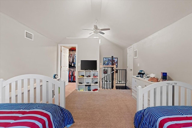 231 Sheline Dr, Havana, FL 32333 - bedroom with carpet flooring, vaulted ceiling, a walk in closet, a ceiling fan, and a closet