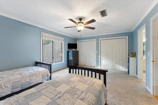 231 Sheline Dr, Havana, FL 32333 - bedroom with two closets, carpet, crown molding, baseboards, and a ceiling fan