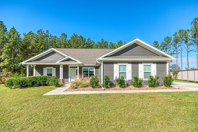 view of front of home featuring a front lawn and covered porch