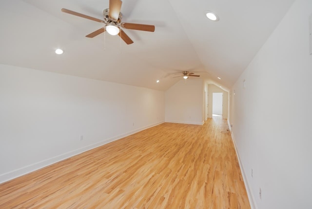 bonus room with ceiling fan, vaulted ceiling, and light wood-type flooring