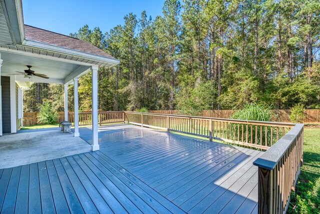 wooden terrace featuring ceiling fan