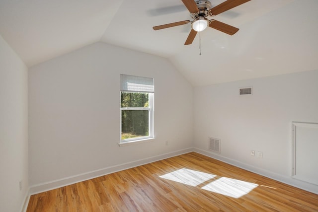 additional living space with ceiling fan, light hardwood / wood-style flooring, and vaulted ceiling