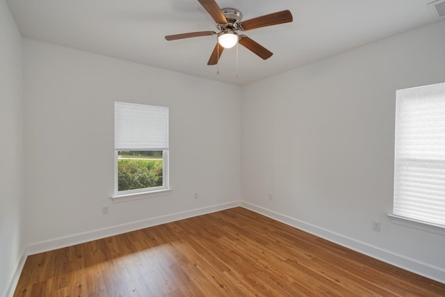 spare room featuring ceiling fan and wood-type flooring