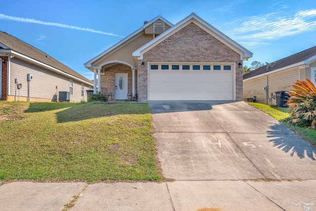 view of front of property featuring central AC, a front yard, and a garage