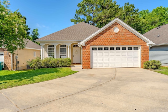 1842 Acorn Ridge Trl, Tallahassee, FL 32312 - view of front facade with concrete driveway, a front yard, brick siding, a garage, and a shingled roof