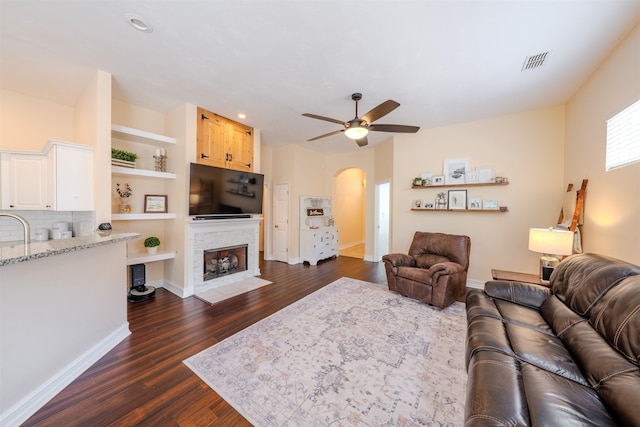 1842 Acorn Ridge Trl, Tallahassee, FL 32312 - living room with arched walkways, a ceiling fan, dark wood finished floors, baseboards, and recessed lighting
