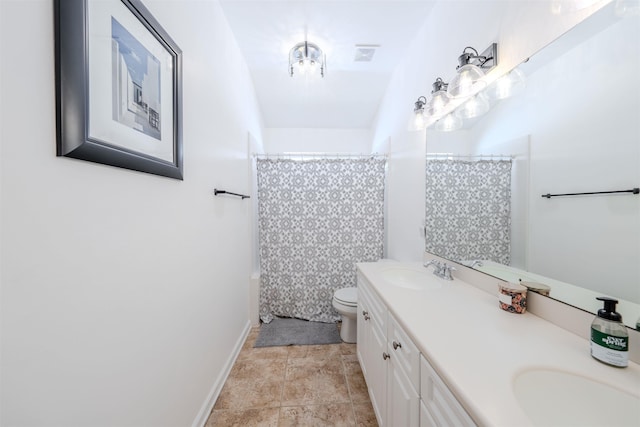 1842 Acorn Ridge Trl, Tallahassee, FL 32312 - full bathroom with toilet, double vanity, and baseboards