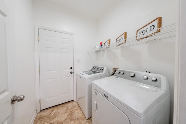 1842 Acorn Ridge Trl, Tallahassee, FL 32312 - laundry room featuring washer and clothes dryer and light tile patterned floors
