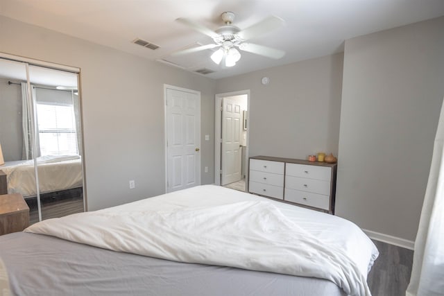 bedroom with wood-type flooring and ceiling fan