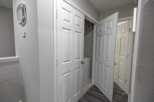 hallway with dark wood-type flooring