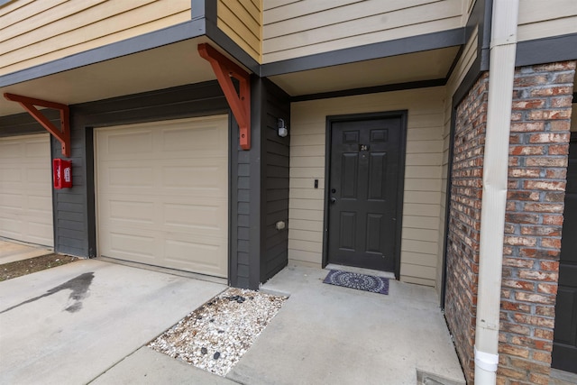 entrance to property featuring a garage