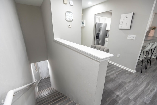 stairway featuring hardwood / wood-style floors