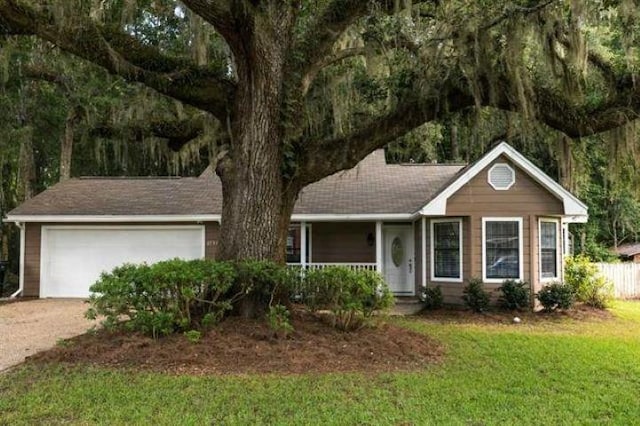 single story home with a garage and a front yard