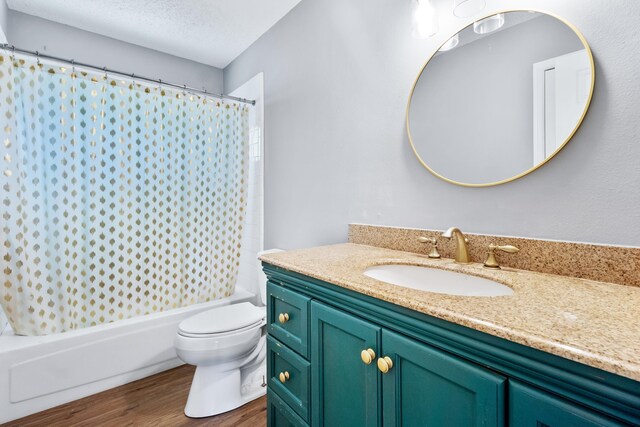 11124 Bexhill Ln, Tallahassee, FL 32317 - bathroom with shower / bath combination with curtain, toilet, a textured ceiling, vanity, and wood finished floors