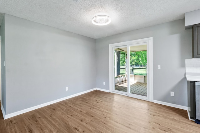 11124 Bexhill Ln, Tallahassee, FL 32317 - interior space featuring a textured ceiling, wood finished floors, and baseboards