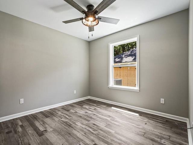 empty room featuring wood-type flooring and ceiling fan