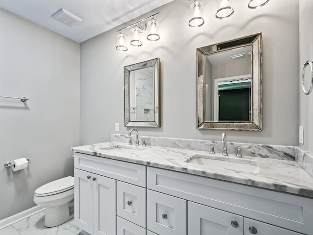 bathroom with vanity and toilet