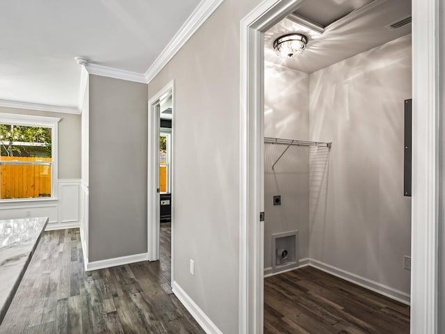 laundry room with crown molding, electric dryer hookup, and dark hardwood / wood-style flooring