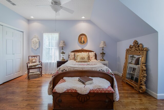 2460 Canopy Ln, Perry, FL 32347 - bedroom with a closet, wood finished floors, lofted ceiling, a ceiling fan, and baseboards
