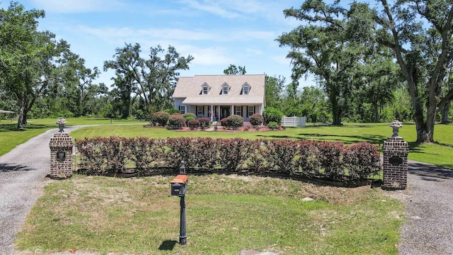 2460 Canopy Ln, Perry, FL 32347 - new england style home with a front yard