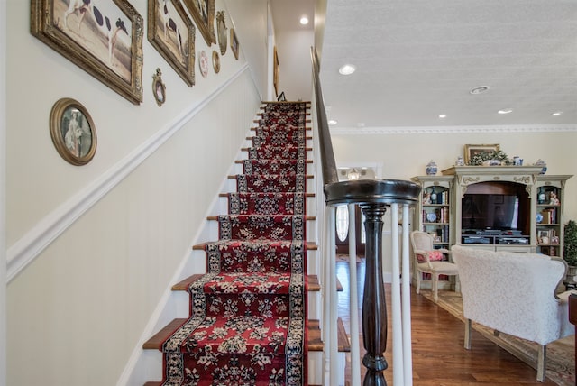 2460 Canopy Ln, Perry, FL 32347 - stairs with wood finished floors, recessed lighting, and crown molding