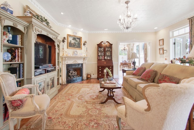 2460 Canopy Ln, Perry, FL 32347 - living area featuring healthy amount of natural light, a chandelier, a fireplace with flush hearth, ornamental molding, and recessed lighting
