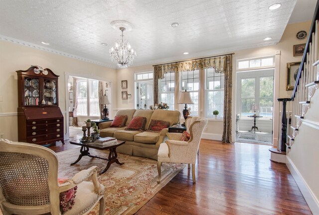 2460 Canopy Ln, Perry, FL 32347 - living room featuring a chandelier, wood finished floors, baseboards, stairs, and recessed lighting