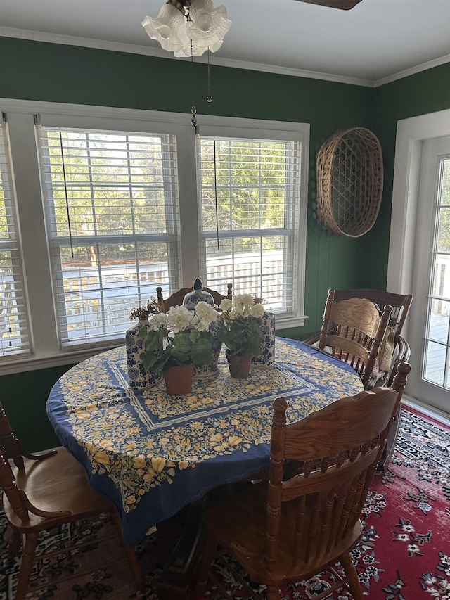 dining room featuring crown molding