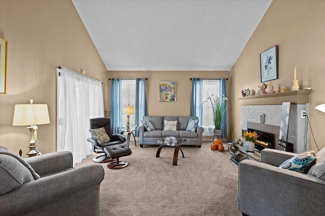 carpeted living room featuring high vaulted ceiling and a brick fireplace