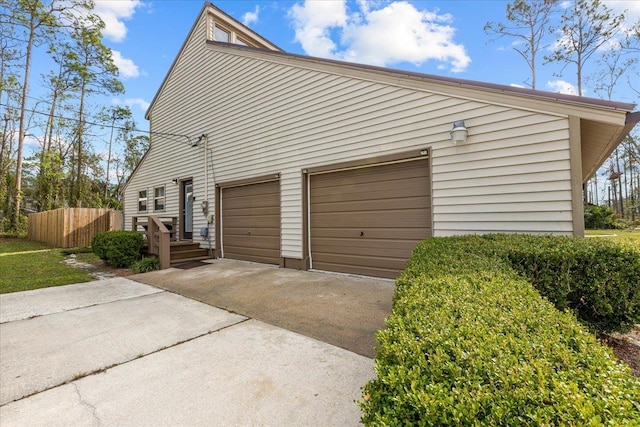 view of side of property with a garage