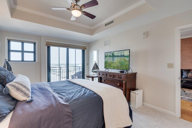121 N Monroe St Unit 1103, Tallahassee, FL 32301 - bedroom featuring access to exterior, a raised ceiling, ornamental molding, light carpet, and ceiling fan
