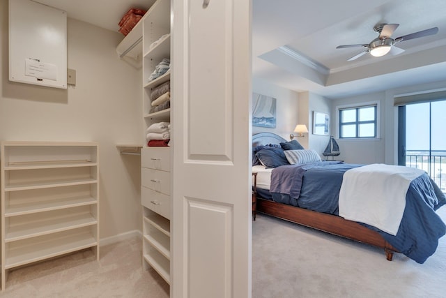 121 N Monroe St Unit 1103, Tallahassee, FL 32301 - carpeted bedroom featuring ornamental molding, access to outside, a tray ceiling, and ceiling fan