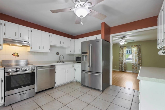 2307 Spoonwood Dr, Tallahassee, FL 32303 - kitchen with appliances with stainless steel finishes, under cabinet range hood, a ceiling fan, a sink, and light countertops