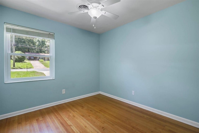 2307 Spoonwood Dr, Tallahassee, FL 32303 - spare room featuring baseboards, wood finished floors, and a ceiling fan