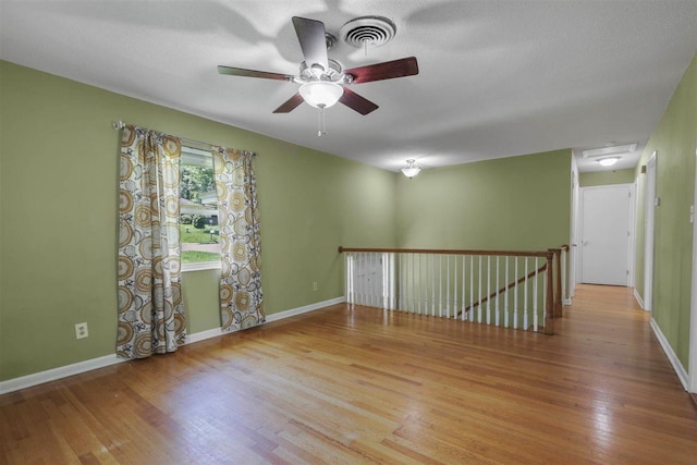 2307 Spoonwood Dr, Tallahassee, FL 32303 - spare room with wood finished floors, ceiling fan, and baseboards