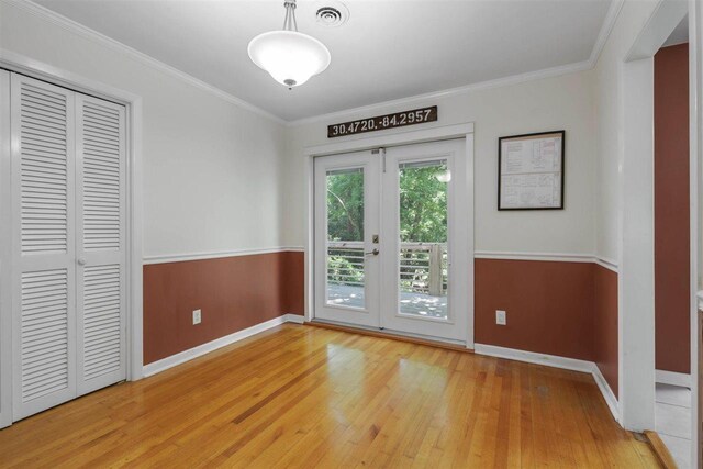 2307 Spoonwood Dr, Tallahassee, FL 32303 - unfurnished dining area featuring light wood finished floors, baseboards, and ornamental molding