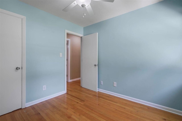 2307 Spoonwood Dr, Tallahassee, FL 32303 - unfurnished bedroom with wood finished floors, baseboards, and a ceiling fan