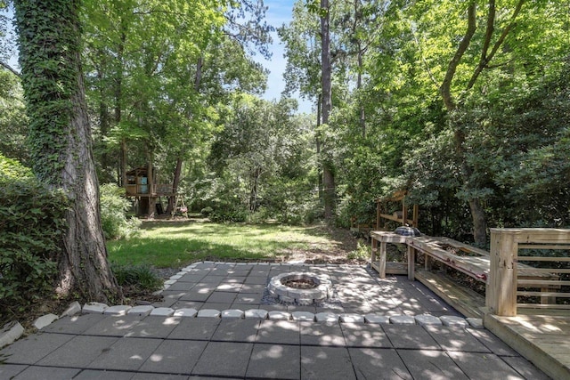 2307 Spoonwood Dr, Tallahassee, FL 32303 - view of patio with a fire pit and a deck