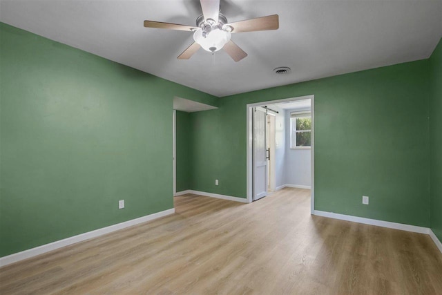 2307 Spoonwood Dr, Tallahassee, FL 32303 - unfurnished room with a ceiling fan, baseboards, and light wood-style flooring