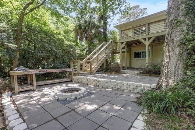 2307 Spoonwood Dr, Tallahassee, FL 32303 - view of patio featuring stairs, a fire pit, and a wooden deck